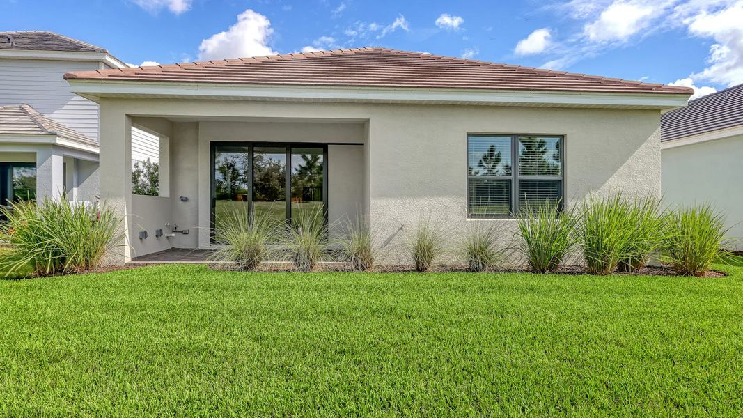 Exterior details and patio area of a home in Palm Grove Real Estate and Homes for Sale in Lakewood Ranch, FL - Neal Communities, Lakewood Ranch (Image 21). Exterior details and patio area of a home in Palm Grove Real Estate and Homes for Sale in Lakewood Ranch, FL - Neal Communities, Lakewood Ranch (Image 21).