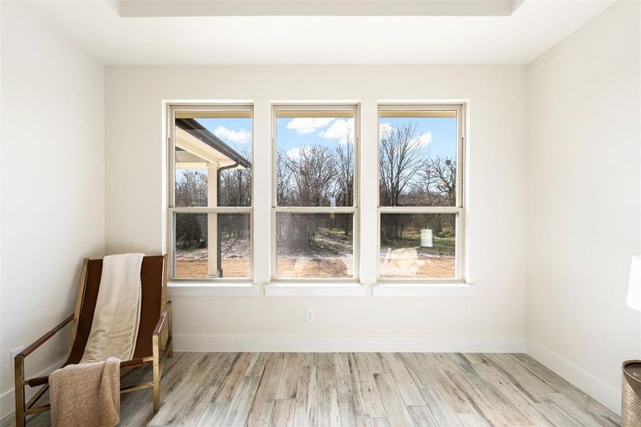 Unfurnished room featuring baseboards and light wood finished floors
