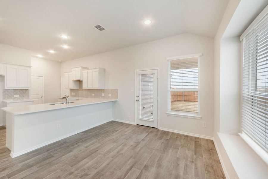 Representative exterior photo of a completed home built from the Joliet by Impression Homes in Heartland, Heartland, TX (Image 15).