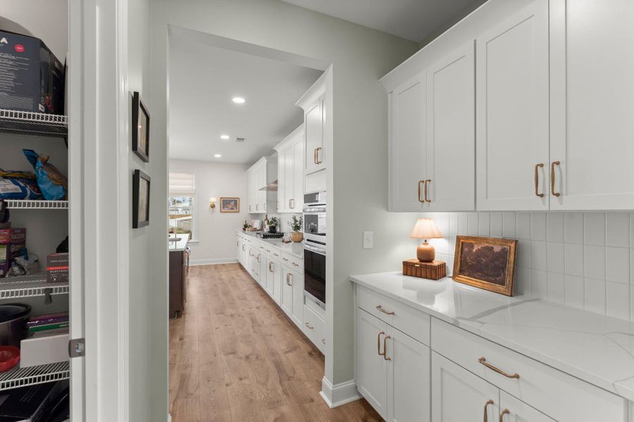 Furnished interior view inside a new home in Tidewater at Lakes of Cane Bay, Summerville (Image 12).