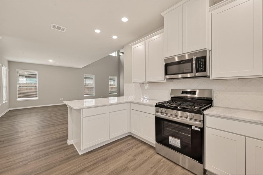 Furnished interior view inside a new home in Sunterra, Katy (Image 8).