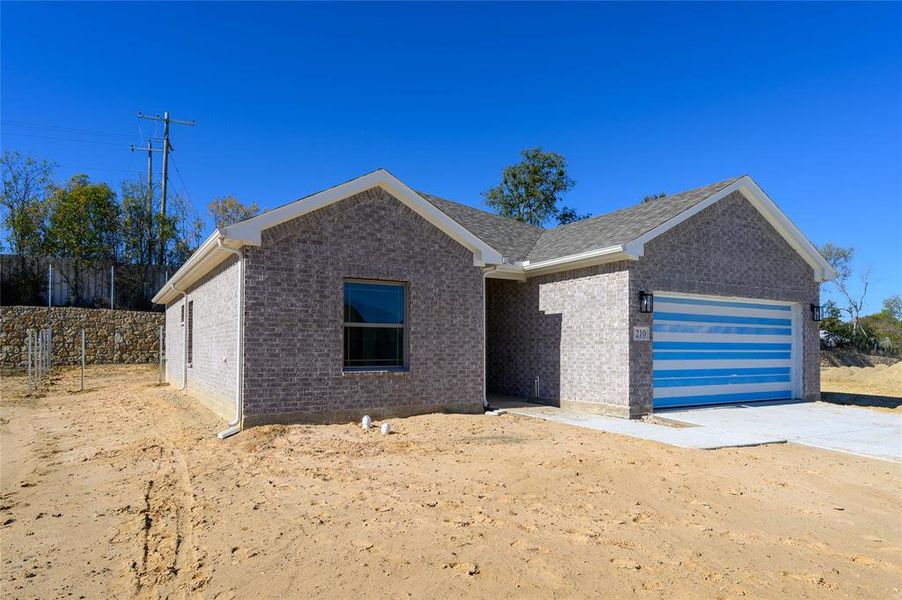 View of front of home featuring a garage