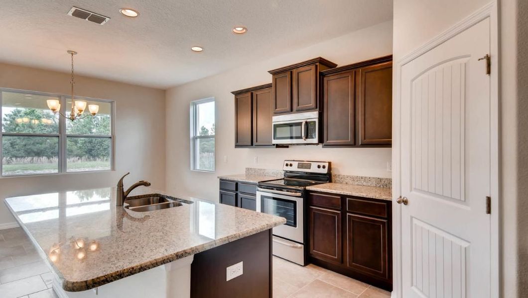 Furnished interior in a model home at Preserves at Lakeside Landings in Winter Haven (Image 40).