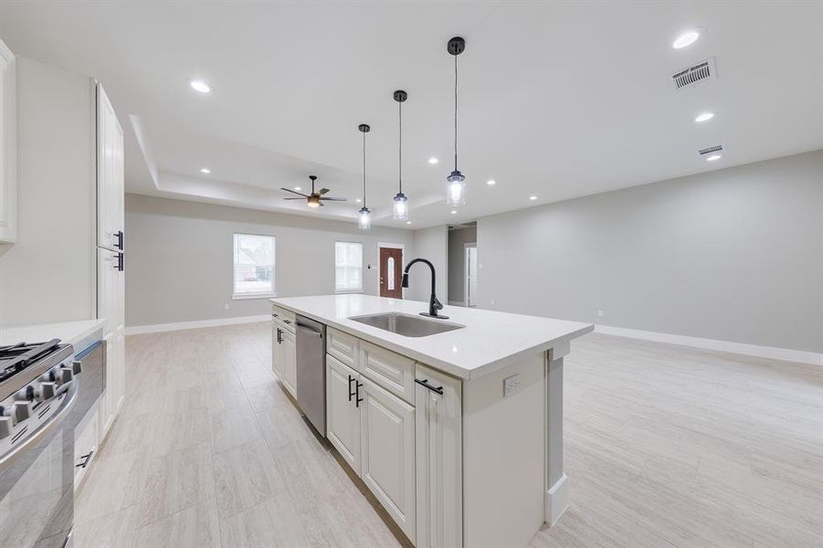 Kitchen island with built-in sink, offering additional workspace and a convenient focal point for meal prep and gatherings.