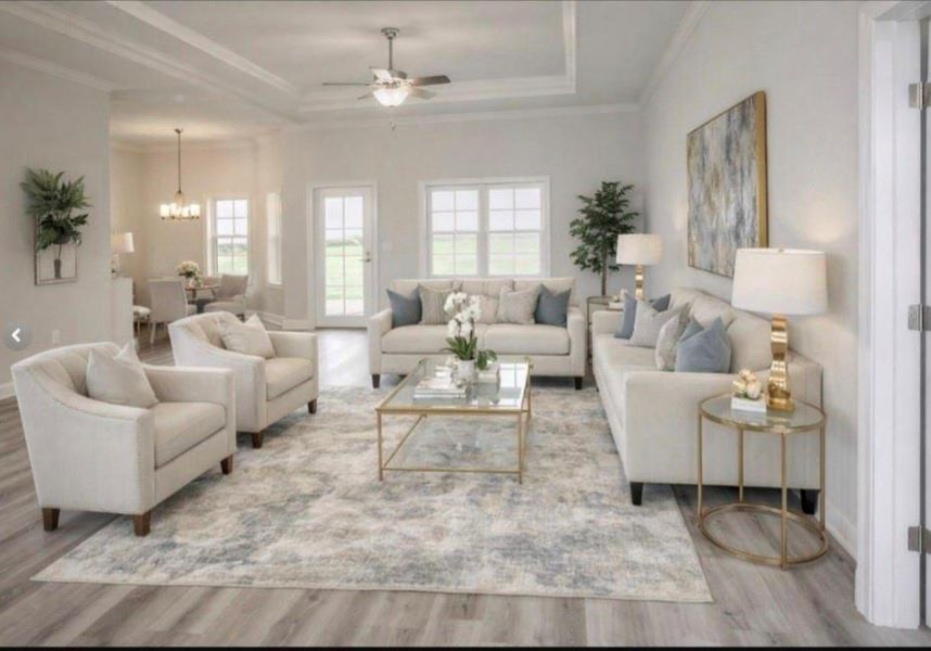 This spacious living room features a neutral color palette with elegant, comfortable seating and modern decor. Natural light pours in through large windows, highlighting the open floor plan that flows seamlessly into the dining area. Perfect for entertaining or relaxing. This spacious living room features a neutral color palette with elegant, comfortable seating and modern decor. Natural light pours in through large windows, highlighting the open floor plan that flows seamlessly into the dining area. Perfect for entertaining or relaxing.