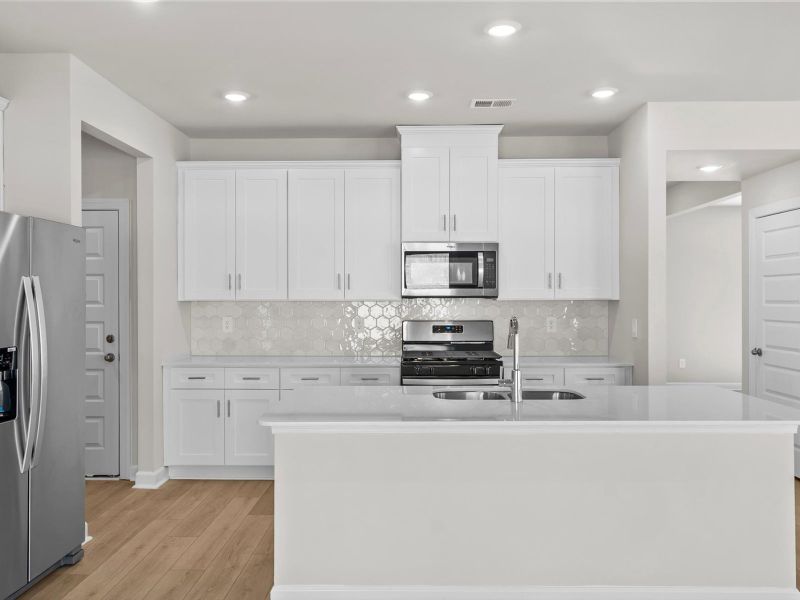 Furnished interior view inside a new home in The Farm at Wells Creek - Signature Collection, Gray Court (Image 3).