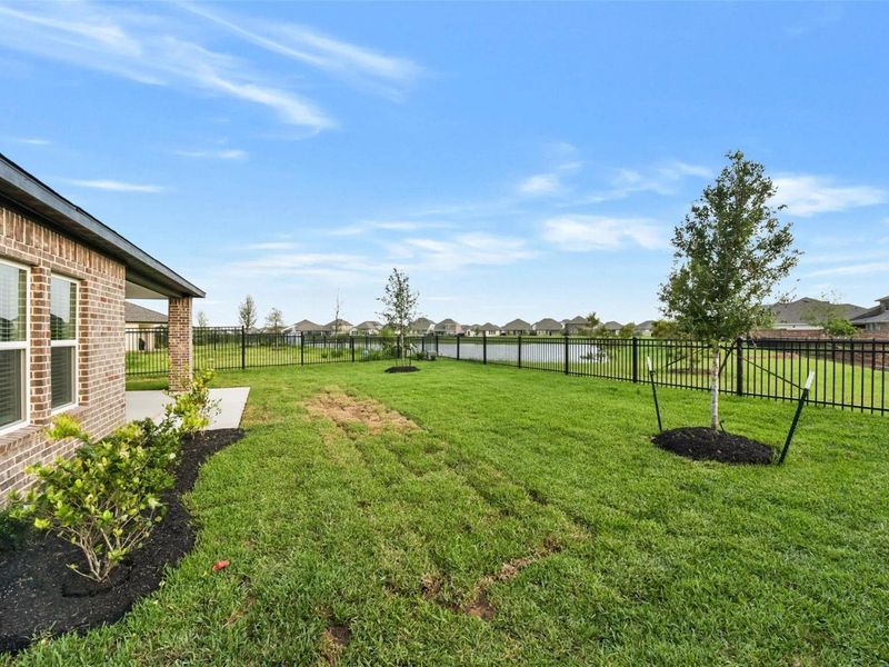 Exterior details and patio area of a home in Sunterra, Katy (Image 4).