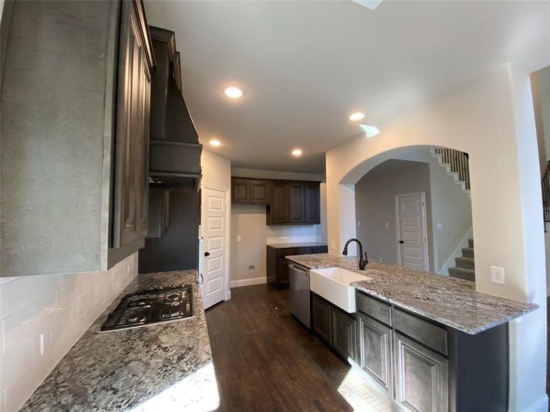 Kitchen featuring rich hardwood floors