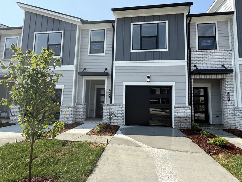 Front exterior of a new home in Nexus Townhomes, Gallatin, TN, highlighting curb appeal (Image 18). Front exterior of a new home in Nexus Townhomes, Gallatin, TN, highlighting curb appeal (Image 18).