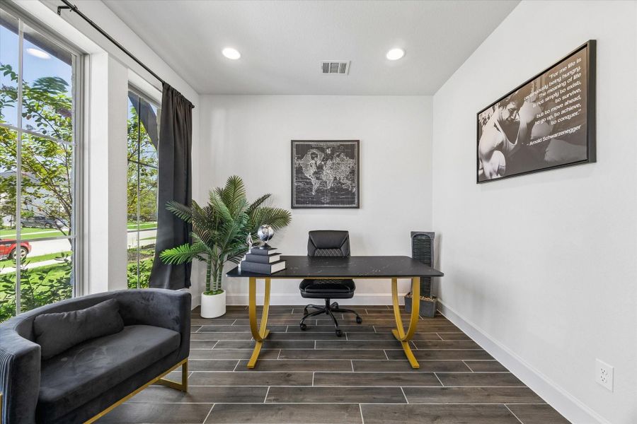Private home office with large front facing windows and abundant natural light