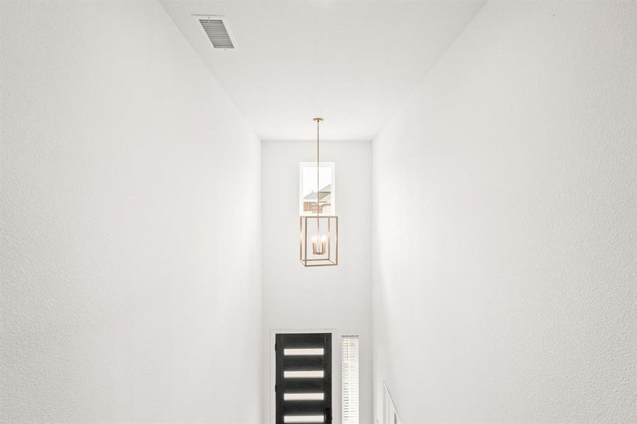 Detailed view of a chandelier and a textured wall