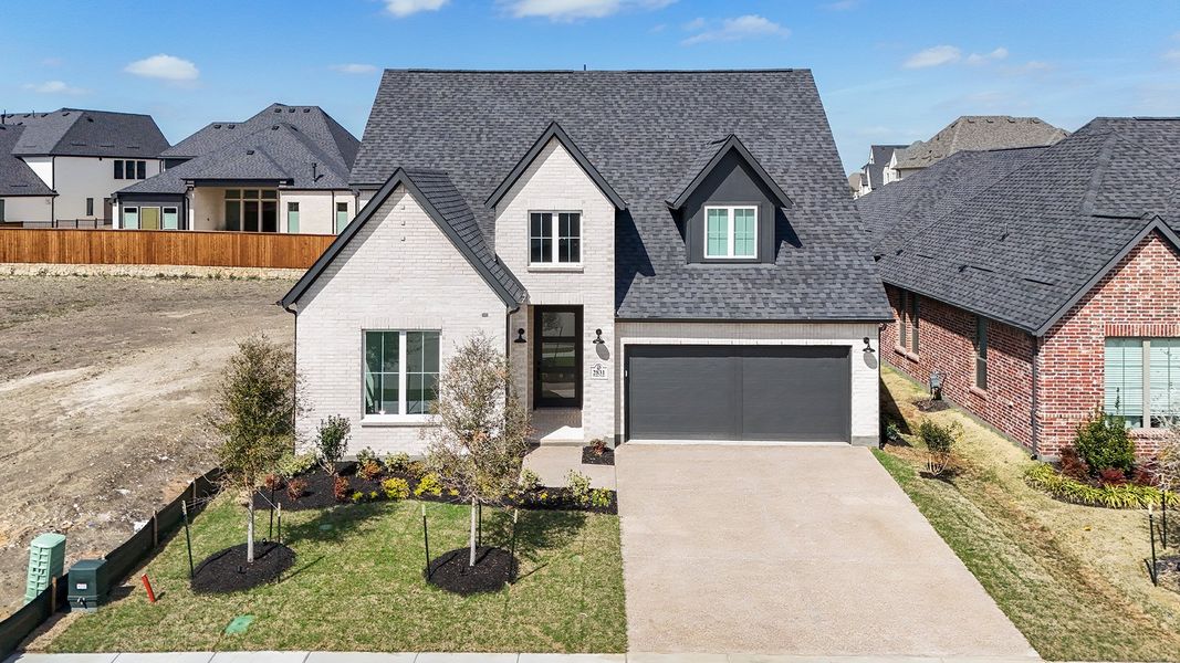 Front exterior of a new home in Brookhollow West, Prosper, TX, highlighting curb appeal (Image 2). Front exterior of a new home in Brookhollow West, Prosper, TX, highlighting curb appeal (Image 2).