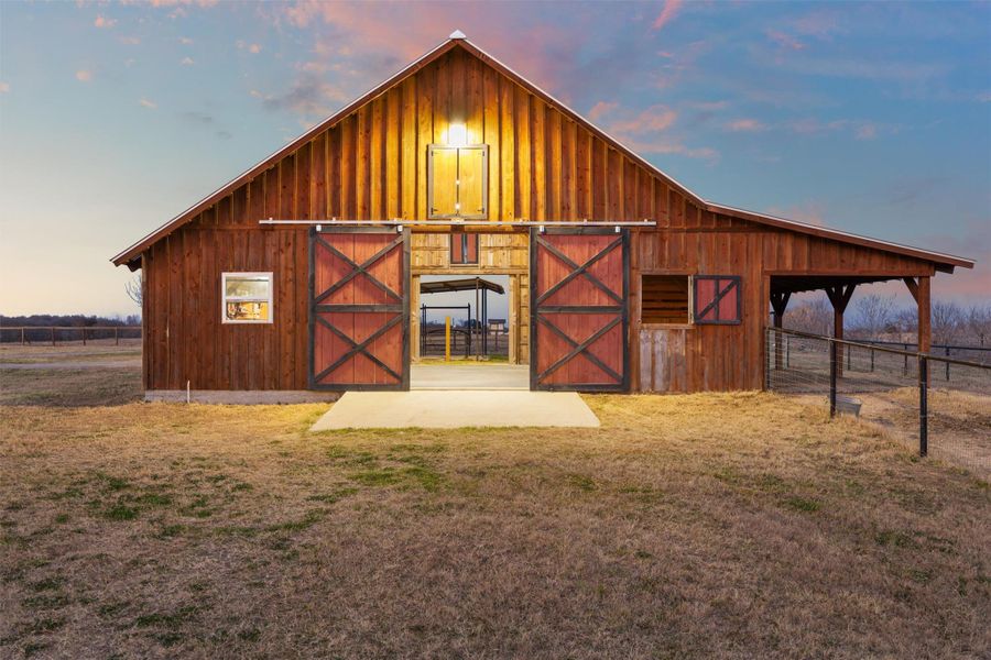 View of barn with tackle room, feeding room and 3 stables.