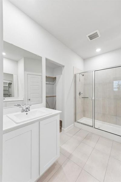 Primary Bathroom in the Cedar home plan by Trophy Signature Homes – REPRESENTATIVE PHOTO