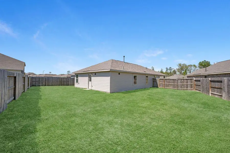 Exterior details and patio area of a home in Tavola, New Caney (Image 4).