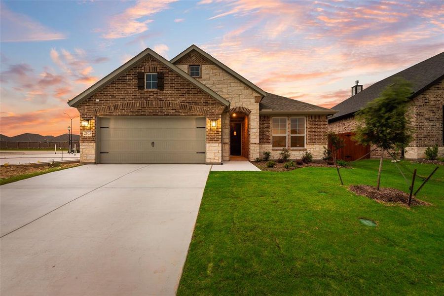 Front exterior of a new home in Northstar, Haslet, TX, highlighting curb appeal (Image 14).