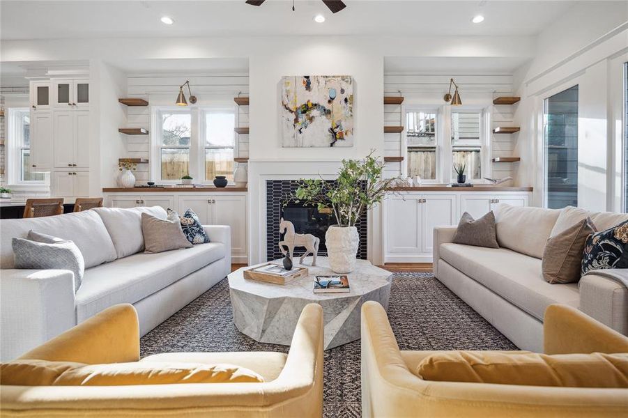 Another family room by The Moder Bungalow. 712 Byrne will have all-stained oak cabinets surrounding the fireplace. The fireplace tile is the same.