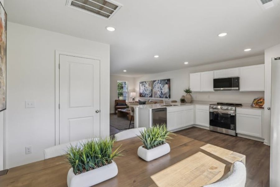 A kitchen with white cabinets. A kitchen with white cabinets.