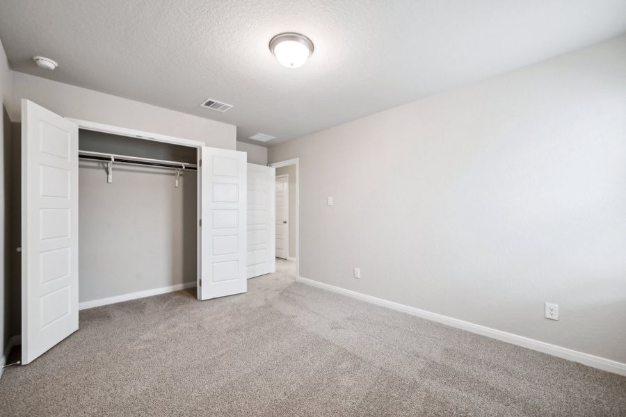 Guest bedroom in the Reynolds floorplan at a Meritage Homes community.