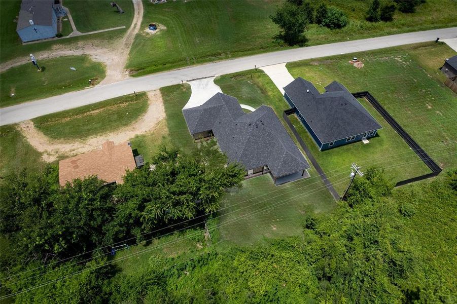 Front exterior of a new home in , Tool, TX, highlighting curb appeal (Image 25). Front exterior of a new home in , Tool, TX, highlighting curb appeal (Image 25).