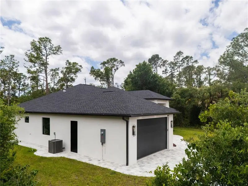 Exterior details and patio area of a home in , North Port (Image 34).