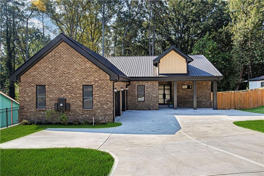 Front exterior of a new home in , Forest Park, GA, highlighting curb appeal (Image 24). Front exterior of a new home in , Forest Park, GA, highlighting curb appeal (Image 24).