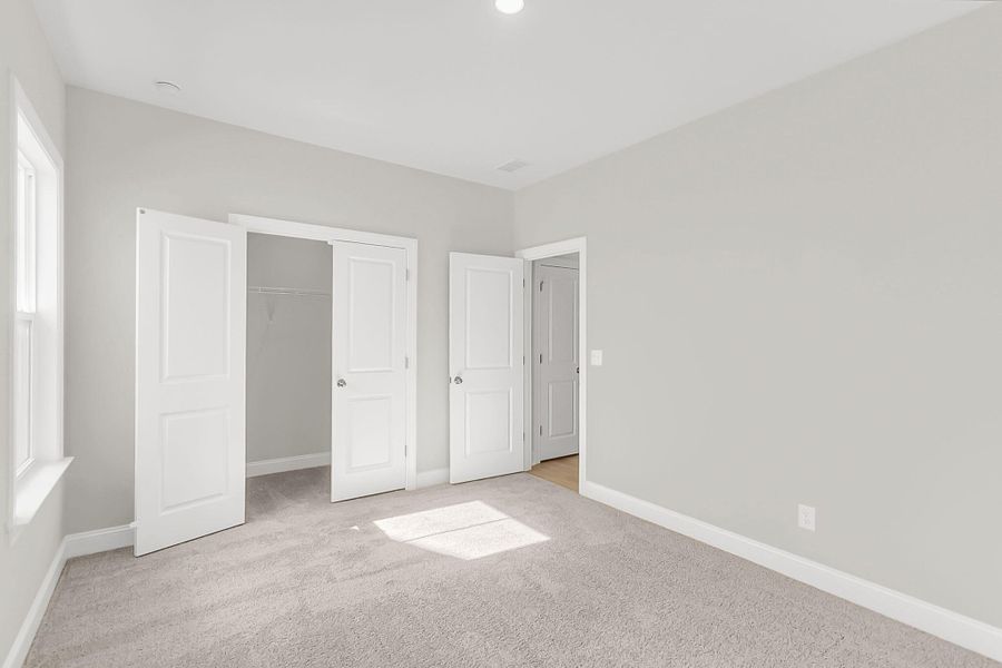 Spacious, unfurnished interior of a new home in Tidewater at Lakes of Cane Bay, Summerville (Image 44).