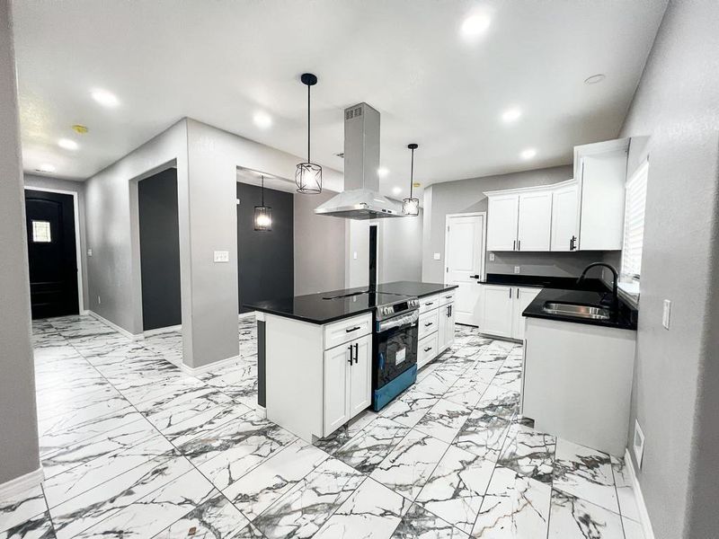 Looking toward Kitchen Dining and Front Entrance from Living Room Looking toward Kitchen Dining and Front Entrance from Living Room