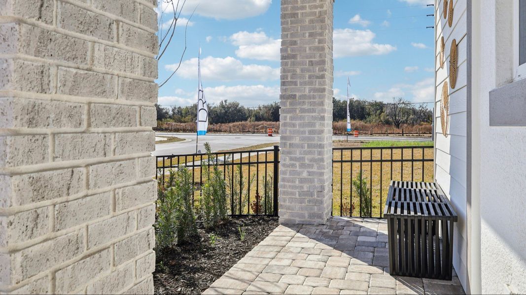 The Mangrove Model Front Porch in a Modern Elevation at Lakeside at Satilla by DRB Homes in Saint Cloud, FL