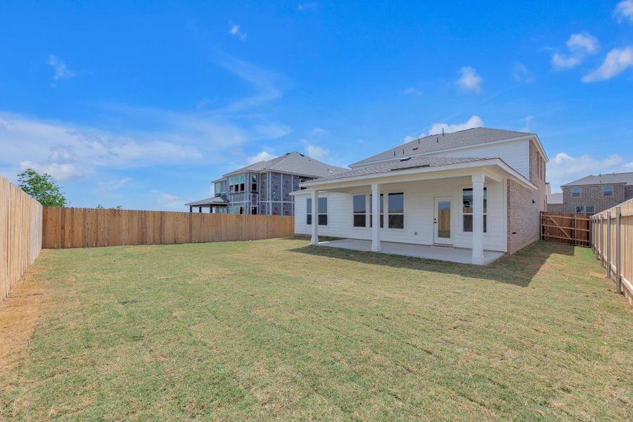 Front exterior of a new home in Salerno - Classic Collection, Round Rock, TX, highlighting curb appeal (Image 2). Front exterior of a new home in Salerno - Classic Collection, Round Rock, TX, highlighting curb appeal (Image 2).