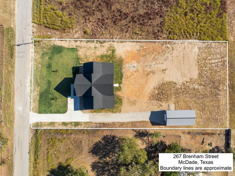 Aerial view of property and surrounding area featuring property parcel outlined