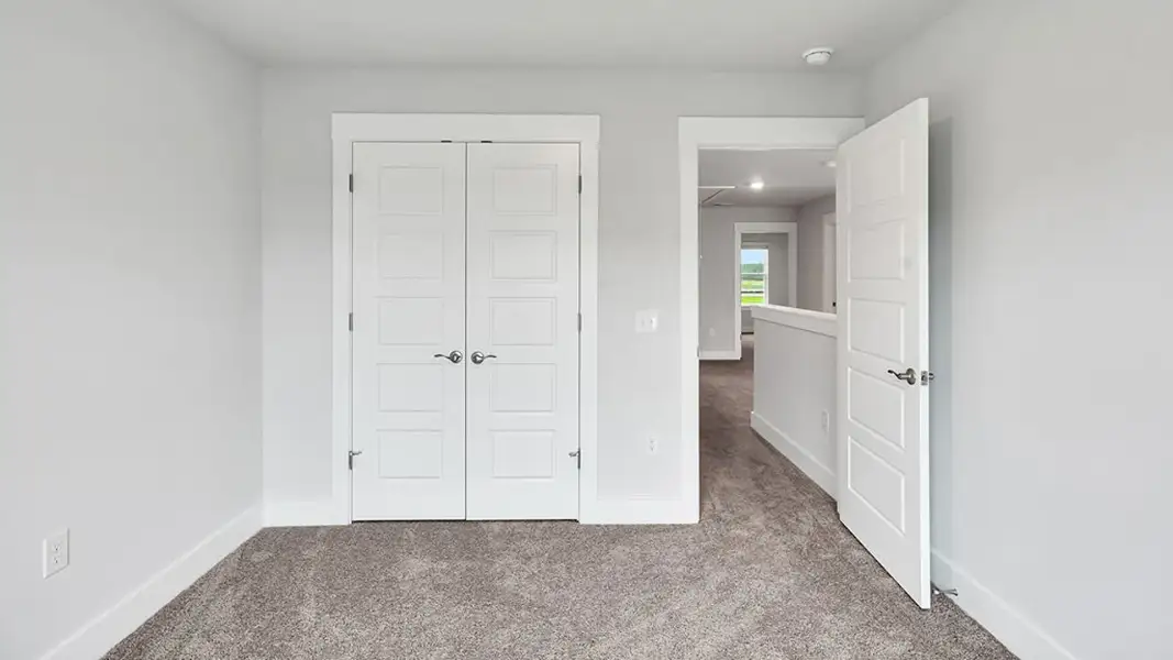 Spacious, unfurnished interior of a new home in The Townes at Cedar Hill Landing, Navassa (Image 29).