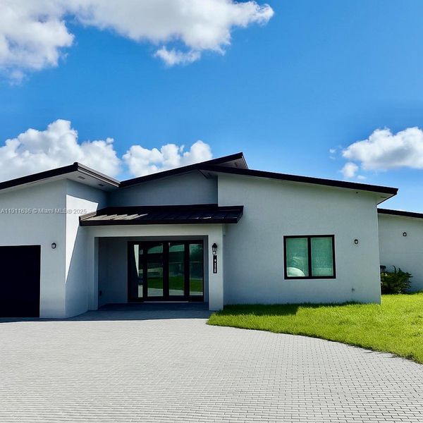 Front exterior of a new home in , Goulds, FL, highlighting curb appeal (Image 19). Front exterior of a new home in , Goulds, FL, highlighting curb appeal (Image 19).