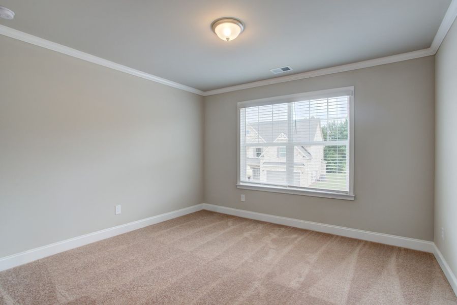 Bedroom 3 with a walk in closet