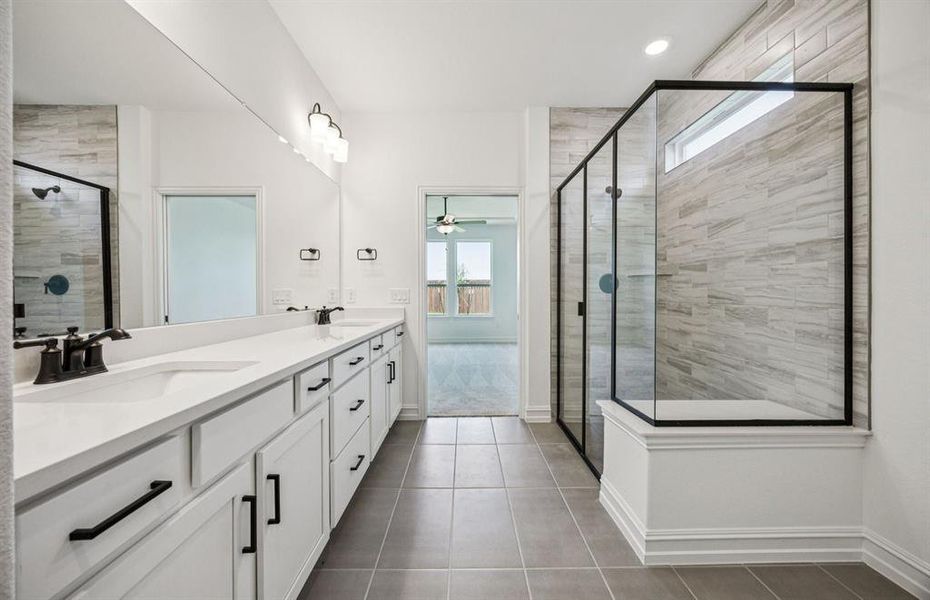 Owner's bathroom features double vanity and large shower Owner's bathroom features double vanity and large shower