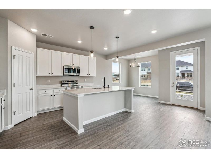 Furnished interior view inside a new home in Parkway at Prairie Center Village, Brighton (Image 7).