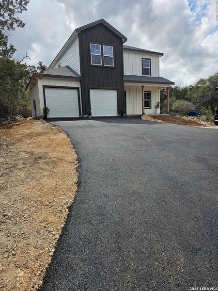 Front exterior of a new home in , Spring Branch, TX, highlighting curb appeal (Image 13).