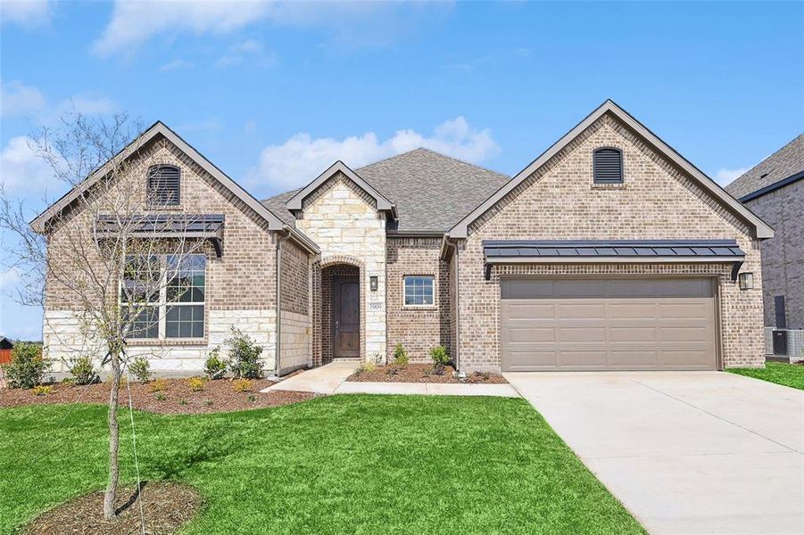 View of front of property with central AC unit, a garage, and a front lawn