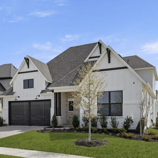 Front exterior of a new home in Mustang Lakes, Celina, TX, highlighting curb appeal (Image 31). Front exterior of a new home in Mustang Lakes, Celina, TX, highlighting curb appeal (Image 31).