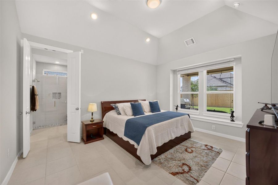 Primary bedroom with vaulted ceiling and window seat. Primary bedroom with vaulted ceiling and window seat.