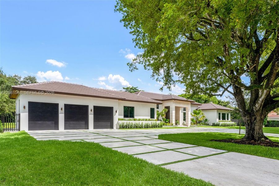 Front exterior of a new home in , Miami, FL, highlighting curb appeal (Image 22).