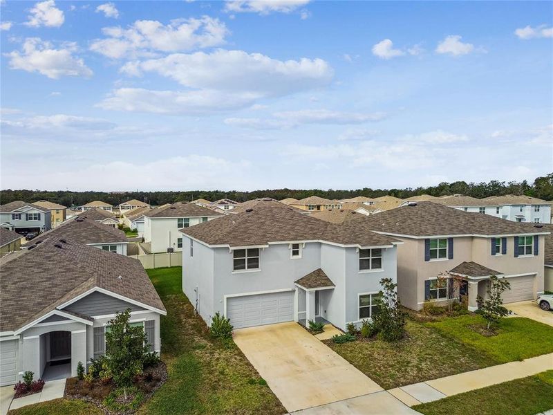 Front exterior of a new home in River Park, Temple Terrace, FL, highlighting curb appeal (Image 24). Front exterior of a new home in River Park, Temple Terrace, FL, highlighting curb appeal (Image 24).