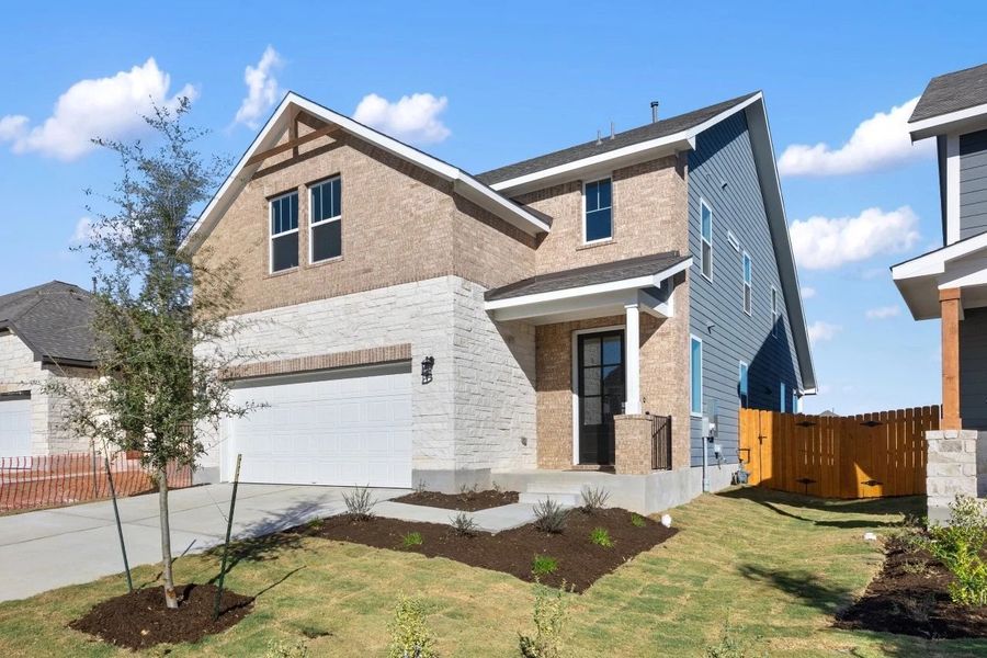 Front exterior of a new home in Lariat, Liberty Hill, TX, highlighting curb appeal (Image 1). Front exterior of a new home in Lariat, Liberty Hill, TX, highlighting curb appeal (Image 1).