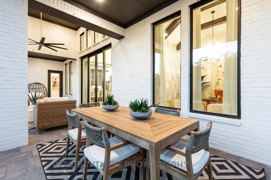 View of patio with a ceiling fan and outdoor dining area View of patio with a ceiling fan and outdoor dining area