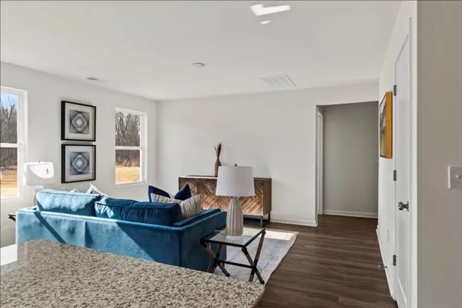A living room with a blue couch.