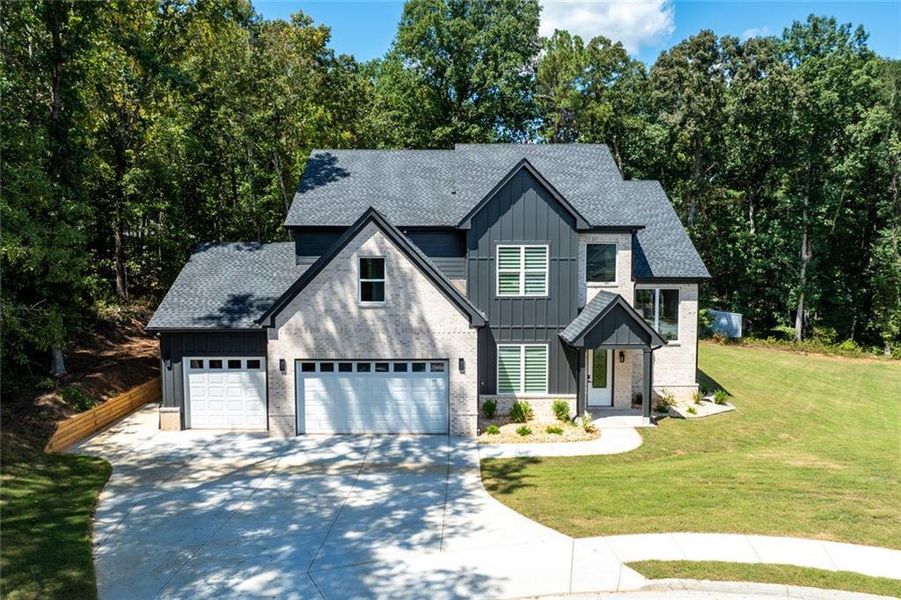 Front exterior of a new home in , Monroe, GA, highlighting curb appeal (Image 27). Front exterior of a new home in , Monroe, GA, highlighting curb appeal (Image 27).