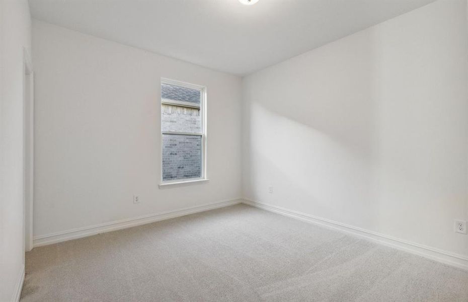 Spacious secondary bedroom with ample closet space *real home pictured