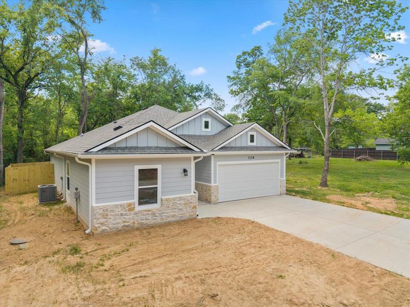 Front exterior of a new home in , Payne Springs, TX, highlighting curb appeal (Image 1). Front exterior of a new home in , Payne Springs, TX, highlighting curb appeal (Image 1).