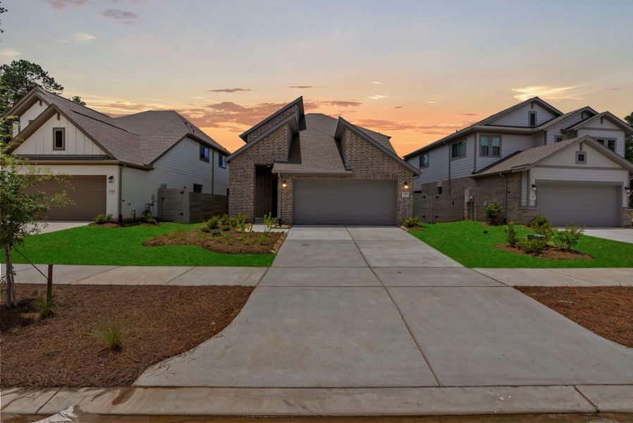 Front exterior of a new home in Two Step Farm, Montgomery, TX, highlighting curb appeal (Image 22). Front exterior of a new home in Two Step Farm, Montgomery, TX, highlighting curb appeal (Image 22).