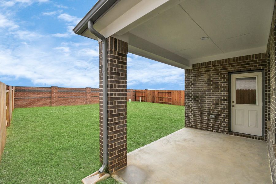 Explore the expansive backyard with its inviting covered patio—a perfect blend of space for the kids to play and adults to unwind. Ideal for creating your outdoor oasis, this backyard accommodates patio furniture, a BBQ pit, and endless possibilities for leisure and entertainment. Sample photo of completed home with similar floor plan. Actual colors and selections may vary.